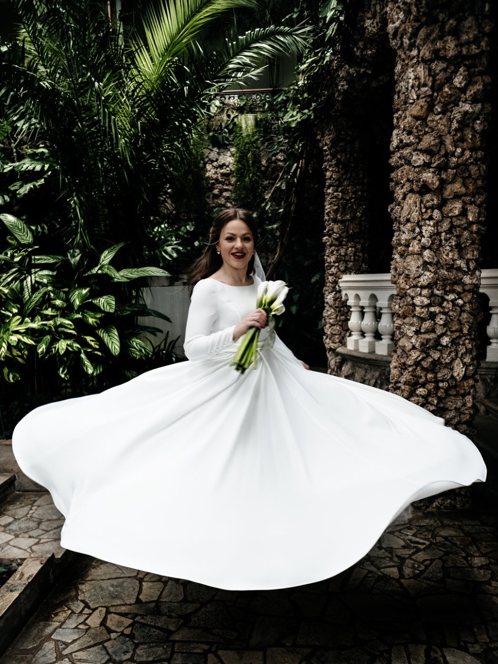 Bride in white dress. Palms