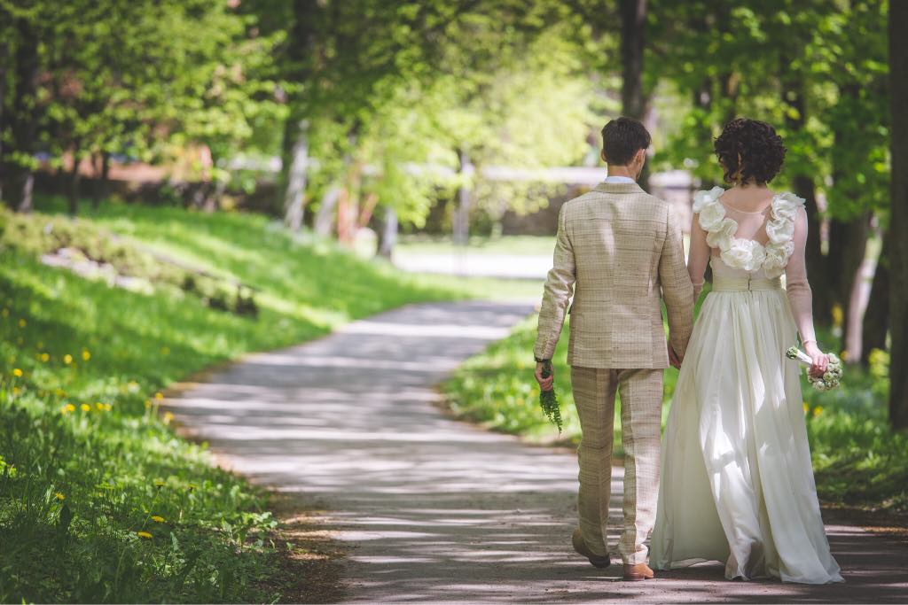 Man walking in a park with light brown costume