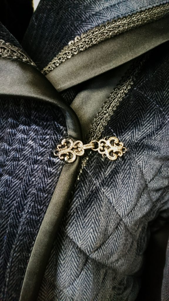 Close up of quilted coat closure