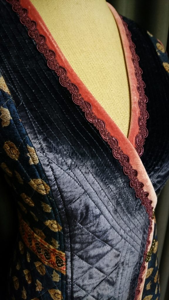 Quilted blue velvet vest with pink details