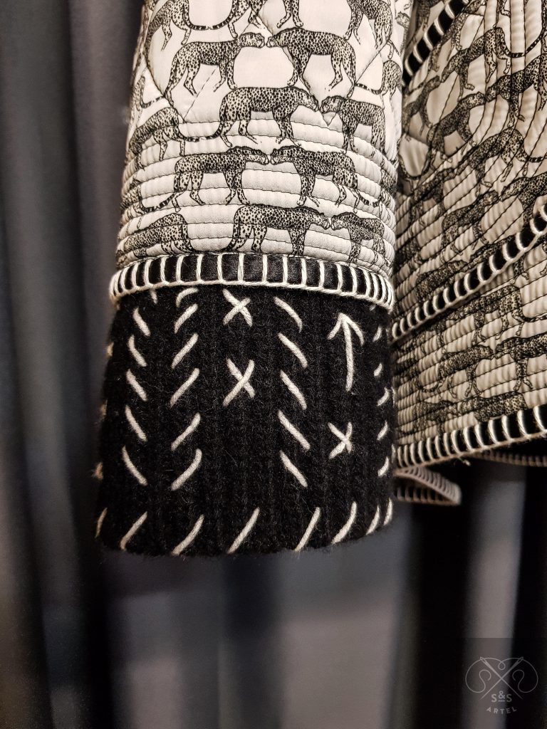 Black and white quilted coat with knited details