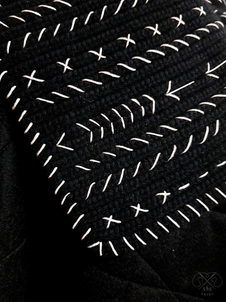Black quilted coat with knited details