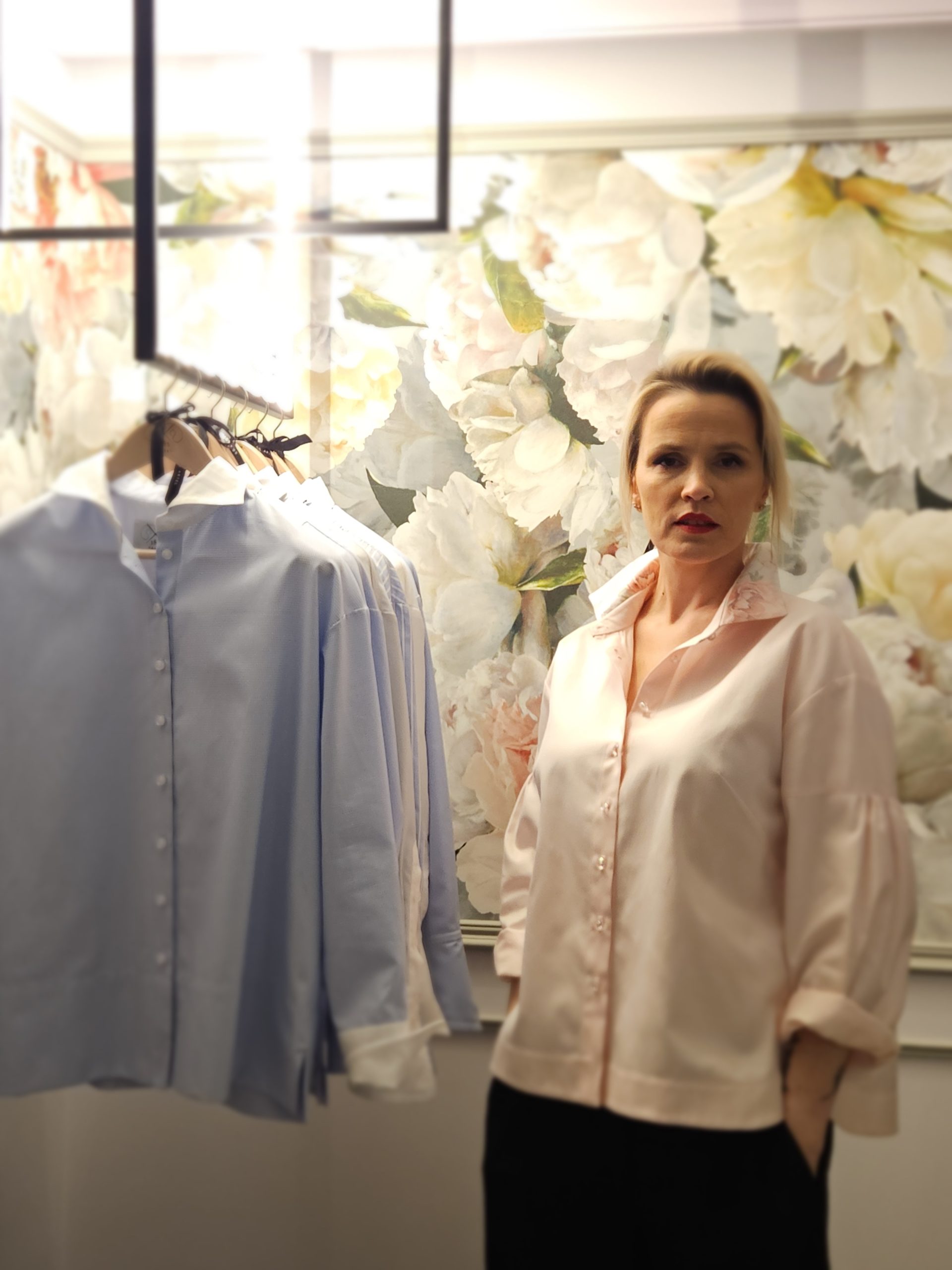 Light pink long-sleeve button-up shirt with a crisp collar and relaxed, modern fit.