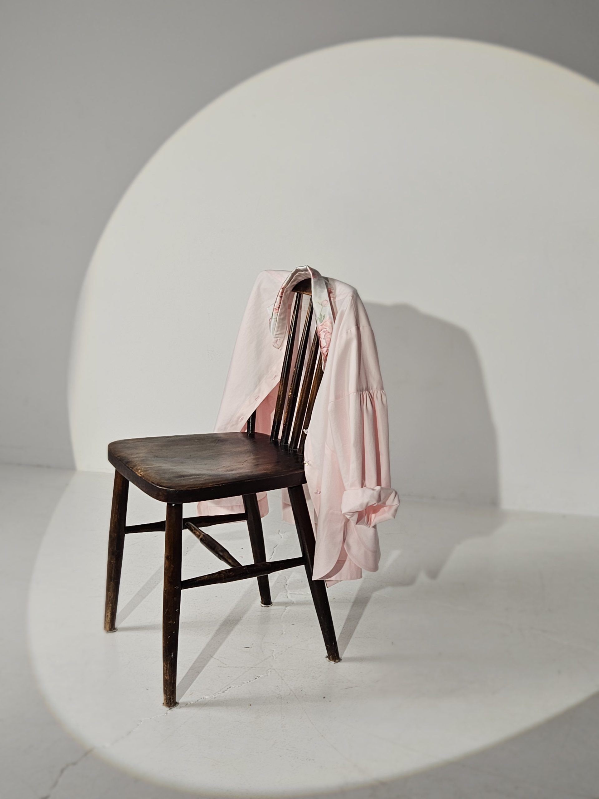 Light pink long-sleeve button-up shirt with a crisp collar and relaxed, modern fit. Silk flower print collar