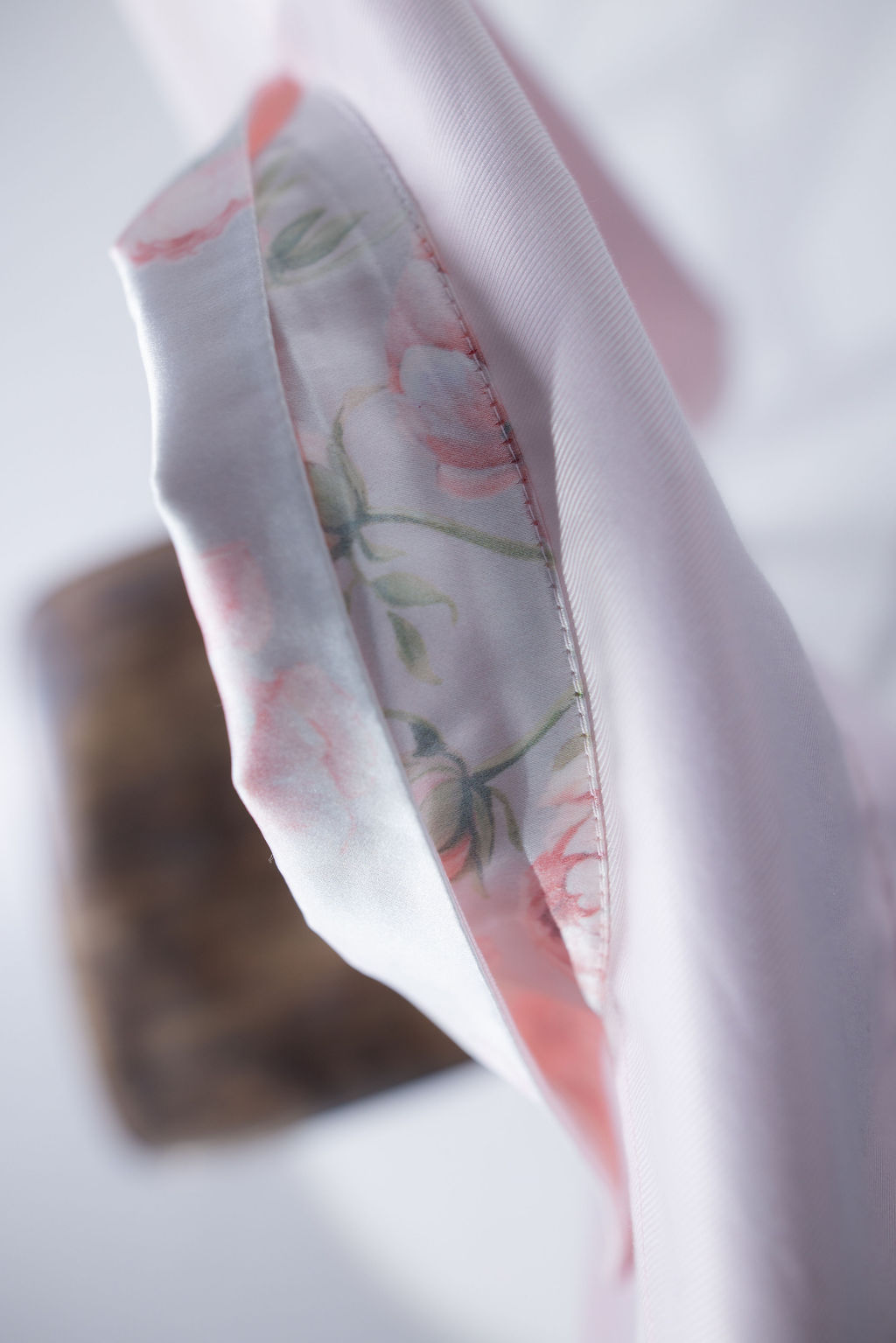 Light pink long-sleeve button-up shirt with a crisp collar and relaxed, modern fit. Silk flower print collar