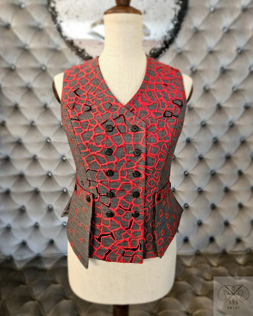 Grey vest with red details on fabric